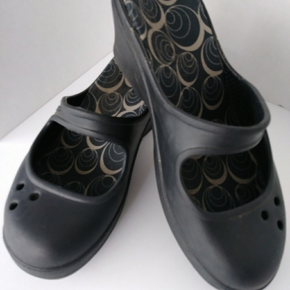 Crocs Mary Jane's slip on with a wedge heel.